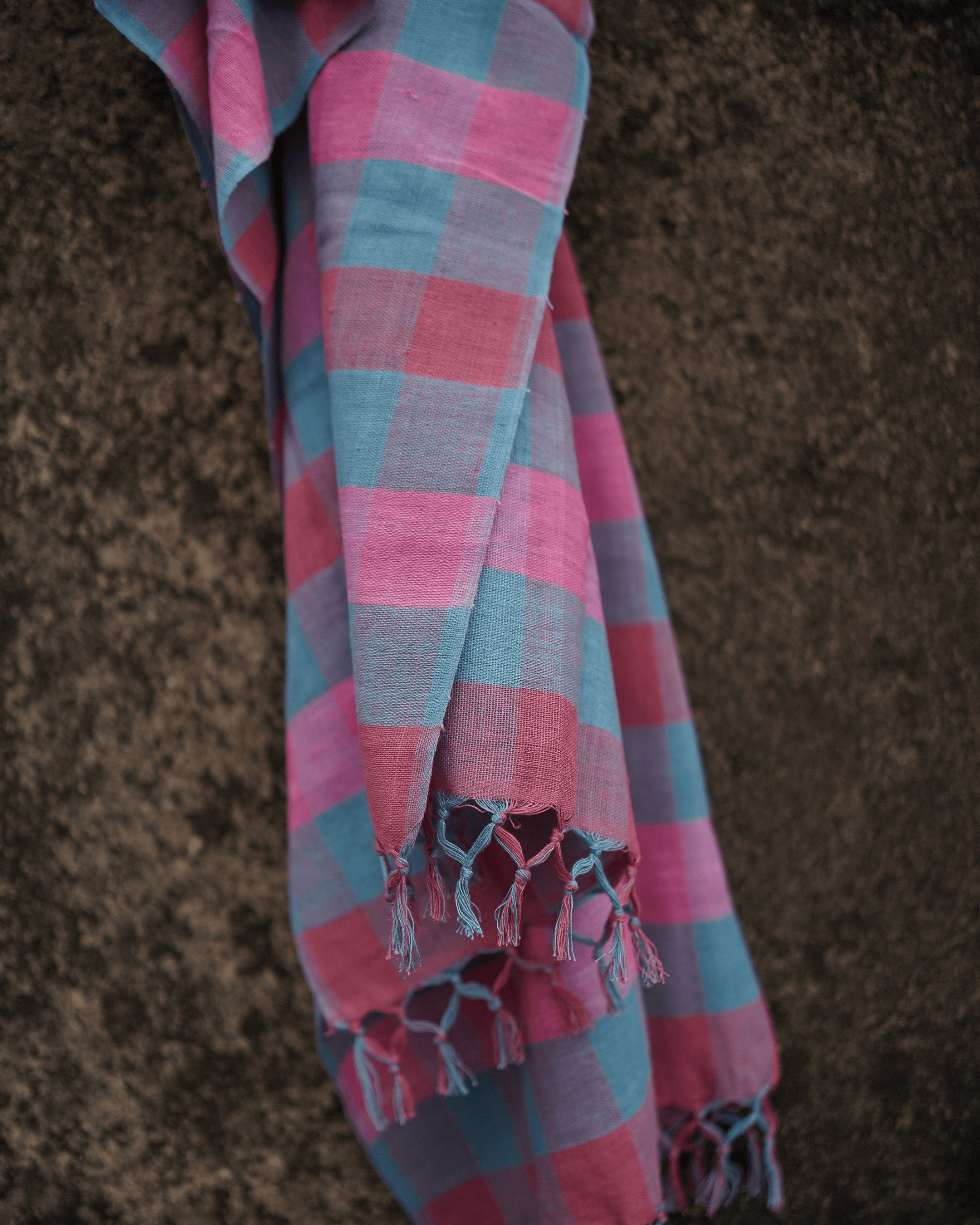 33 counts handwoven cotton stole with natural dye colors in pink and blue checks, highlighting artisanship from West Bengal.