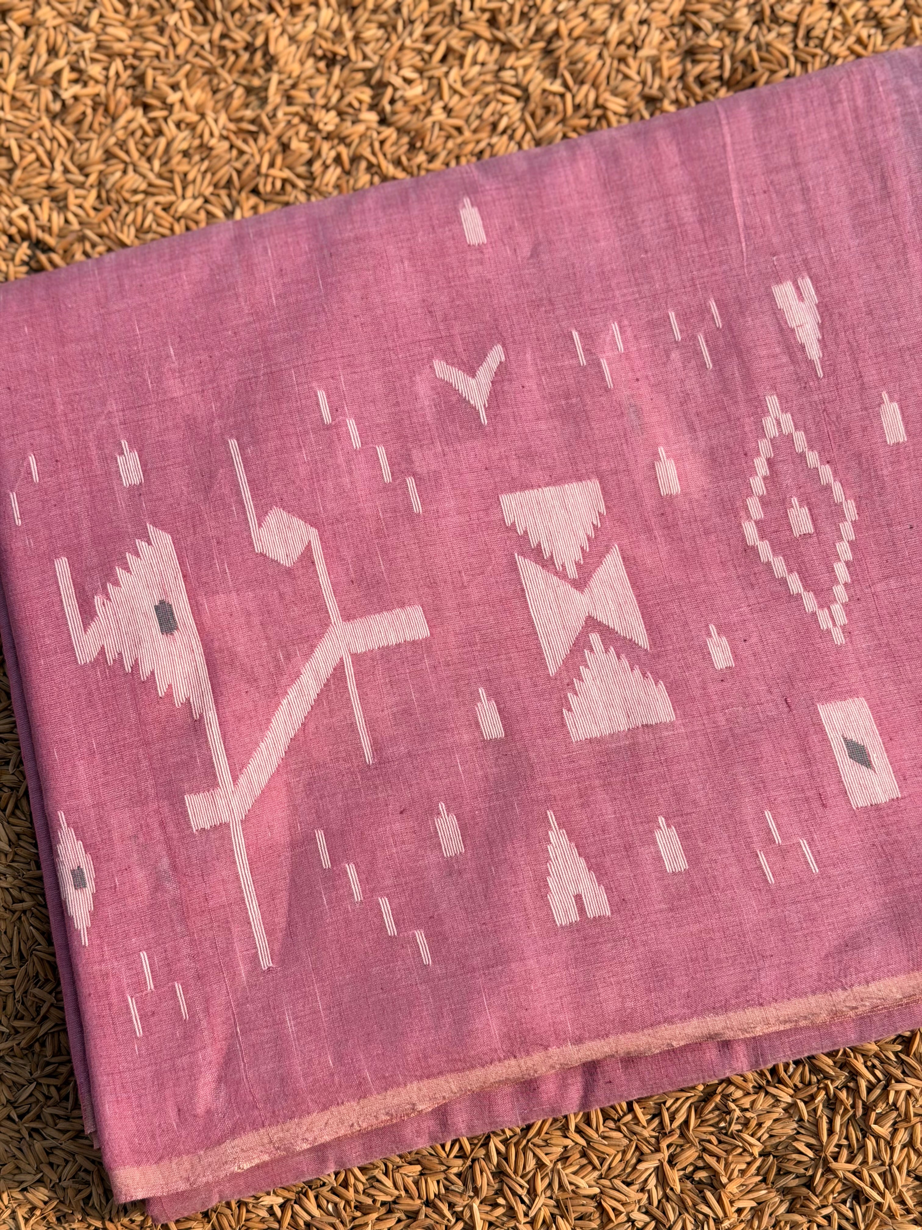 Jamdani Muslin fabric in Pink with white Motifs