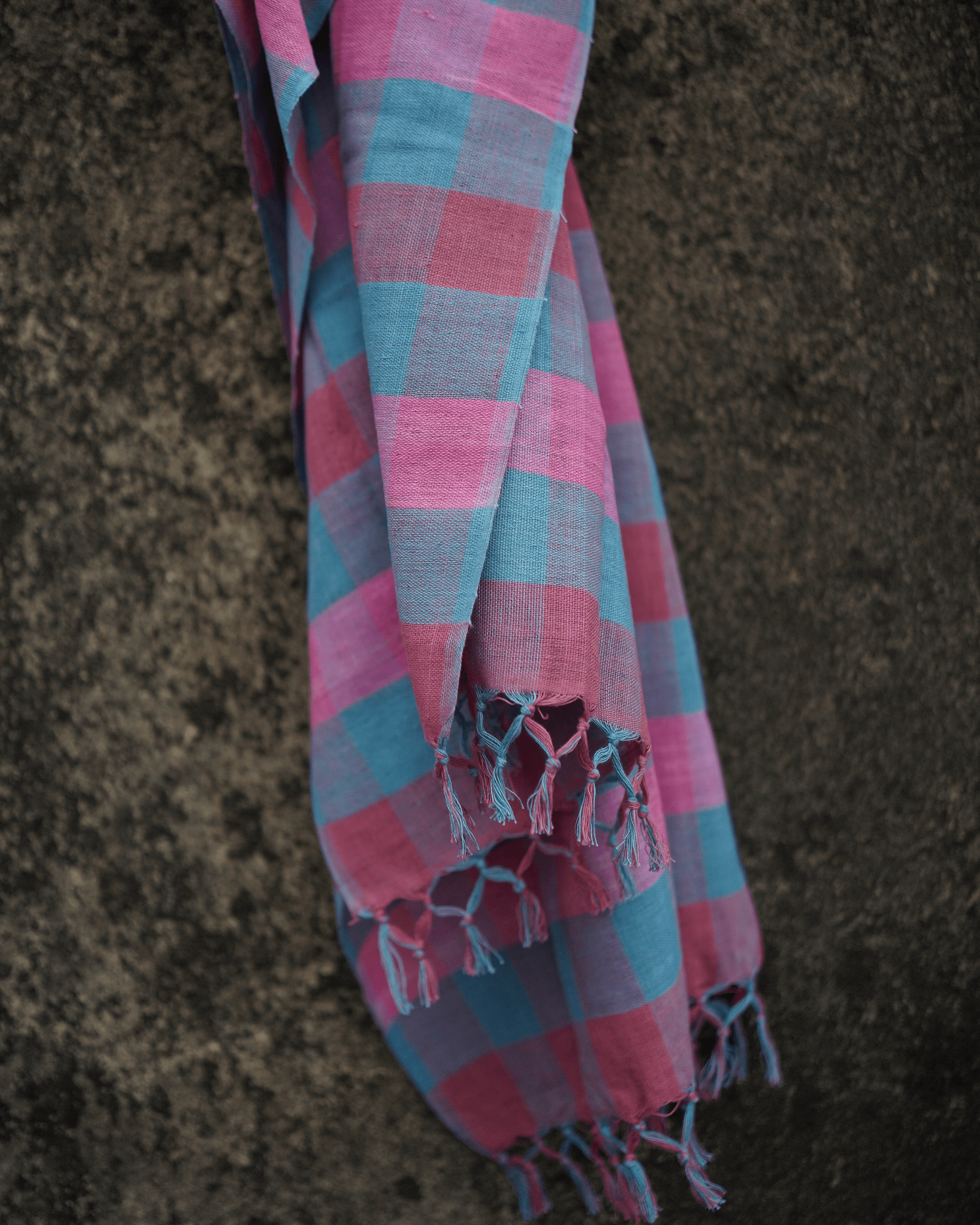 Handwoven 33 counts cotton stole with natural dye color checks in pink and blue, showcasing traditional craftsmanship.