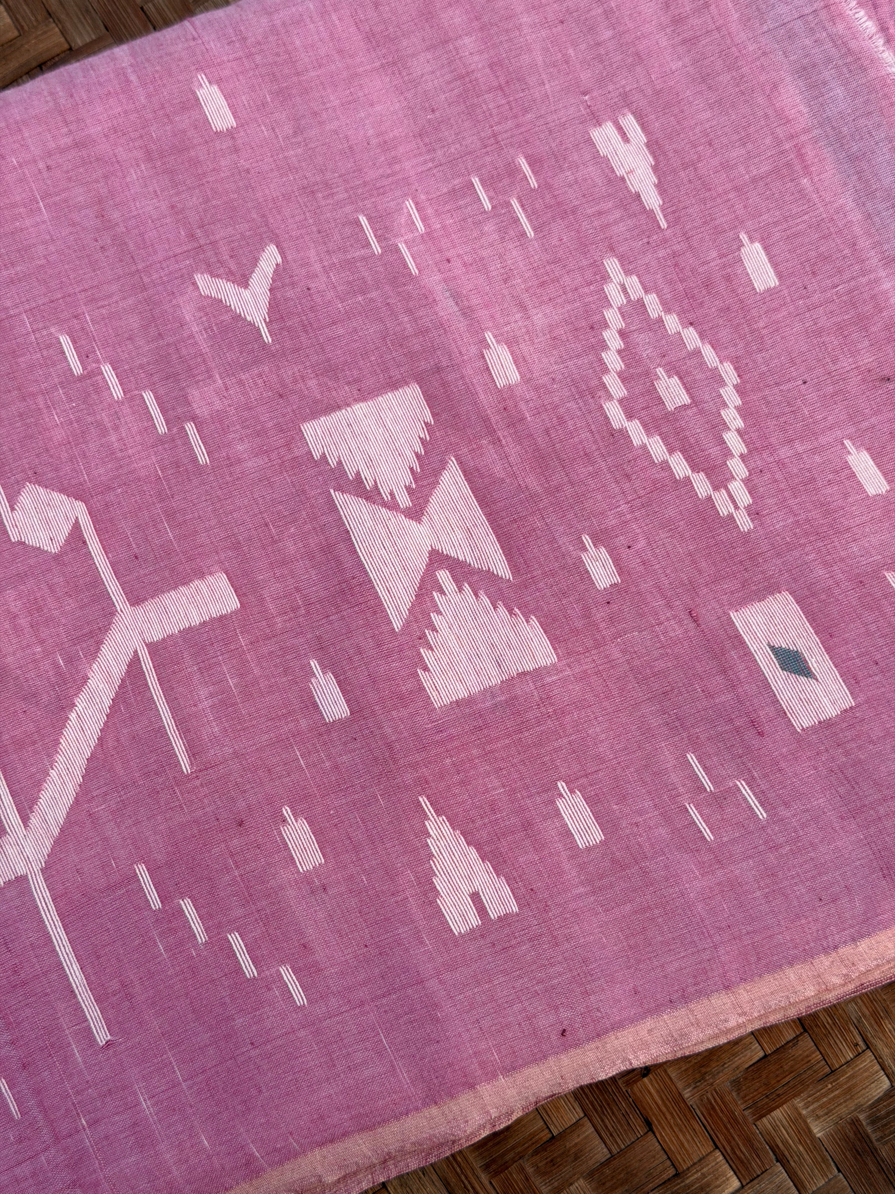 Jamdani Muslin fabric in Pink with white Motifs