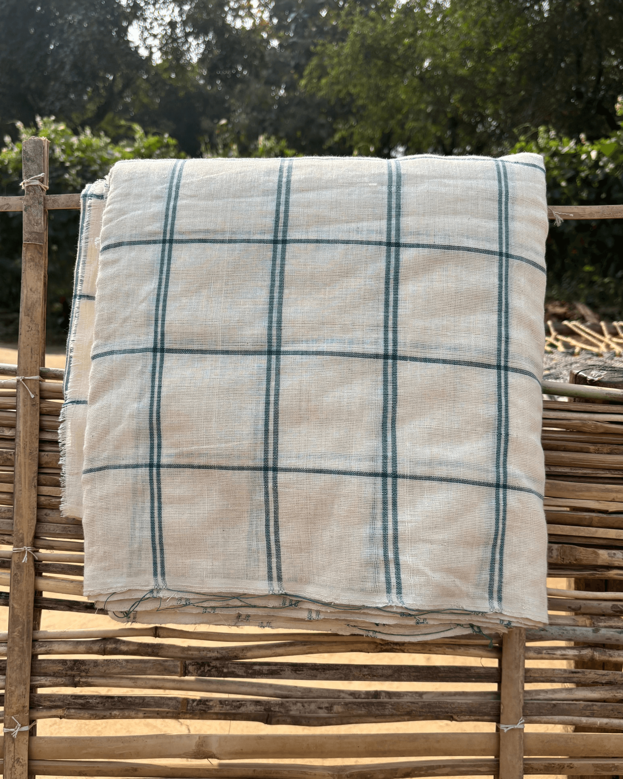 33 counts Indigenous Variety rain-fed cotton checks fabric showcasing handspun artistry in natural dye colors.